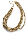 Get wrapped up in the season with this golden torsade necklace from Charter Club. Rows of plastic and glass beads add a lovely layer to your look. Crafted in gold tone mixed metal. Approximate length: 18 inches + 3-inch extender.