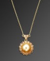 Add a warm drop of sunshine to your look. CRISLU pendant highlights a glass champagne-colored pearl (10 mm) accented by sparkling round-cut cubic zirconias (2-1/2 ct. t.w.). Set in gold over sterling silver. Approximate length: 16 inches. Approximate drop: 1/2 inch.