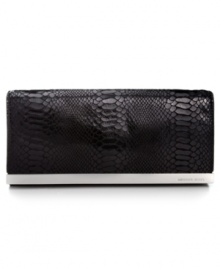 Organization with elegance. Chic python-embossed leather and gleaming signature hardware offer instant appeal to this MICHAEL Michael Kors design that discretely transforms from a shoulder bag to a clutch in a wink. The superbly organized interior is aligned with plenty of compartments for cash, cards, ID and lip gloss.