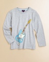 You already know he's a rock star--show the world in this comfy cotton tee finished with a colorful electric guitar motif.Ribbed crewneckLong sleeves74% cotton/26% polyesterMachine washImported of French fabric