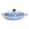 The bright and cheery Le Creuset braiser, available in an array of colors, is designed for a variety of cooking techniques, and its low profile makes it a convenient serving solution for crowded tables and buffet-style settings. From rich risottos and spicy curries to jasmine rice, the enameled cast iron braiser is well-suited for preparing a wide range of main courses and side dishes that require careful moisture control.