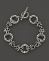 An intricately etched link bracelet in sterling silver. By Konstantino.