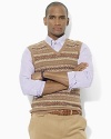 Knit from the finest cotton and cashmere yarns for a smooth hand, this timeless sweater vest is emboldened with a heritage Fair Isle pattern.