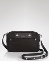 Put personal style in focus with MARC BY MARC JACOBS' nylon camera bag. Dual purpose: The case jives as a crossbody or slips in a tote so you won't miss (fashionable) photo ops.