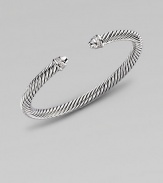 From the Color Classic Collection. A signature Yurman cable of sterling silver, richly enhanced by bands of pavé diamonds, encircling the end caps. Diamonds, 0.09 tcw Sterling silver Cable, 5mm Diameter, about 2½ Made in USA