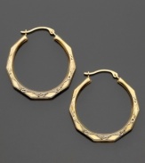 You'll love the vintage-style engraving on these beautiful hoops crafted in 14k gold. Approximate diameter: 3/4 inch.