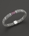 Bead-textured bracelet from Lagos in sterling silver, accented with pink sapphire.