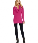 A cable-knit cowl neckline gives this tunic-length sweater from MICHAEL Michael Kors a chic, classic finishing touch.