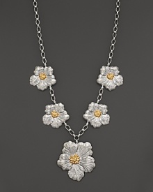 Delicate gardenias, captured at the height of their beauty in sterling silver and 18K yellow gold, bloom on this necklace from Buccellati.