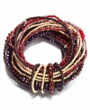 Intricately intertwined. A complex array of beading (including bugle beads, seed beads and glass rondelles) embellishes this stylish stretch bracelet from c.A.K.e. by Ali Khan. Featuring a rich fall palette of reds and browns, the stretch design lets it slip on and off with ease. Approximate diameter: 2-1/4 inches.