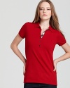 Timeless and seasonless--the makings of a staple. Do basics Brit-style with this classic polo. From Burberry Brit.