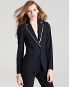 Impeccably tailored, this Elie Tahari stretch wool jacket exudes graphic sophistication with contrast double lapels. The black-and-white sentiment beautifully showcases colorful blouses or slim pants.