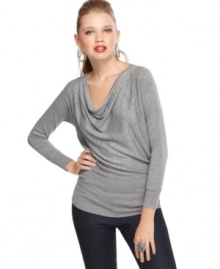 The cowl neck top from GUESS? has a casual fit that looks great with dark wash jeggings and embellished flats.