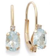 Sparkling perfection. Add a vibrant pop of color to your look with oval-cut aquamarine (3/4 ct. t.w.) and sparkling diamond accents. Crafted in a 14k gold leverback setting. Approximate drop: 3/4 inch.