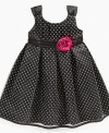 Magnificent dot galore dress by Penelope Mack with bright rosette on satin sash.