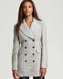 Pristine tailoring and refined style meet on this tweed Burberry London double-breasted coat with logo-embossed buttons and decorative front flap pockets. A classic finishing piece for workdays and weekends alike, pair it with denim or trousers for posh polish.