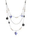 Airy and alluring. A lightweight look defines Betsey Johnson's three-row illusion necklace, making it an effortless addition to your jewelry collection. Detailed by glass pearls, glittering flowers and sparkling crystal accents, it's crafted in hematite tone mixed metal. Approximate length: 16 inches. Approximate drop: 3 inches.