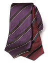 Richly hued stripes on a silk lavish Canali tie translate to new season.