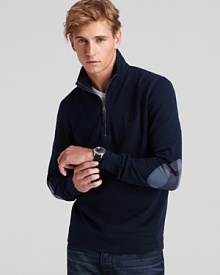 Everyday laidback with an edge, this preppy-tweaked pullover features a half-zip high neck and plaid elbow patches.