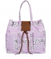 Stylish tote in fine, pure lilac cotton - Ultra-durable canvas fabric in a chic paisley bandana print Embossed leather logo plaque and tassel embellishment - Two top handles and snap closure - Two practical exterior open pockets - Fully lined, with large interior zip pocket - Utilitarian and casually cool, ideal for everyday leisure