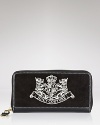 Soft velour, trimmed with leather, gets the royal treatment with a Juicy Couture crest.