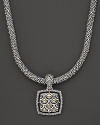 From the Naga collection, a gold and silver woven chain necklace with square Naga pendant, designed by John Hardy.