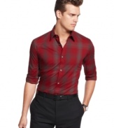 Macy's holiday exclusive! Crafted in a cool heathered plaid, this shirt from Calvin Klein will be your new seasonal standard.