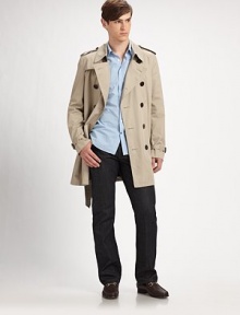 Sleek and sophisticated rain trench, designed in signature lightweight cotton with removable wool liner.ButtonfrontDouble breastedShoulder epaulettesSide slash pocketsRear ventAbout 27 from shoulder to hemFully linedCottonDry cleanImported