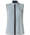 Elegant top made ​.​.of fine, ice blue silk - Mega stylish with a stand-up collar, pleated draping and accent stitching - The cut is feminine fitted and slim - Slightly longer cut, sleeveless - A great fashion upgrade for simple basics - Chic under a pants suit, rocking with leather pants, casual with jeans