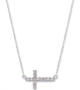 Symbolic sparkle with a taste of modernity. This pretty sideways cross pendant features round-cut diamonds (1/8 ct. t.w.) and a 14k white gold setting and chain. Approximate length: 17 inches. Approximate drop: 1/2 inch.