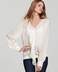 Sheer elegance can be yours with this Pippa silk top, ruffled through the front and accented with black dome buttons at the cuffs. Ethereal for this season of ladylike style, the silhouette takes office staples to the next level of chic.