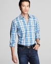 Each button of this handsome plaid shirt is unique, adding a subtle designer touch. It's always about the details.