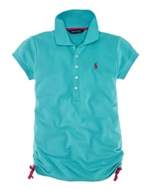 A classic short-sleeved polo shirt is updated with vibrant colors and ruching at the sides.