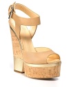 Cut-out cork wedges anchor gleaming leather. Pair Giuseppe Zanotti's elegant wedges with slim, cropped trousers.