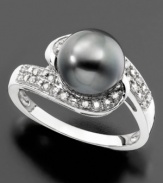 Indulge in intrigue. This spectacular ring features a dark cultured Tahitian pearl (7mm) and round-cut diamonds (1/8 ct. t.w.) set in 14k white gold.