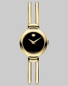 Timepiece and jewelry in one, a double bangle bracelet of goldplated stainless steel has a black Museum dial. Quartz movement Water-resistant to three ATM Round case, 18mm Adjustable bracelet, 10mm Made in Switzerland