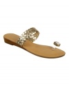 Twinkle toes. Show off your perfect pedicure with the revealing Turin demi-wedge sandals from Carlos by Carlos Santana.