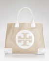 Undeniably effortless, Tory Burch's must-have tote shines on in patent leather.