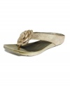 A pretty eye-catching centerpiece. Kenneth Cole Reaction's Flower Park thong sandals are a blend of beauty of comfort.