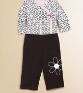 Bold, beautiful daisies adorn the bodysuit and pants of this plush cotton two-piece set with snaps and and elastic waistband. Bodysuit V-neckLong sleevesFront snapsBottom snaps Pants Elastic waistbandCuffed hemCottonMachine washImported Please note: Number of buttons/snaps may vary depending on size ordered. 