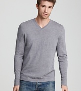 A soft, sleek sweater from Elie Tahari in fine merino wool. Contrast stripes along inner sleeves and sides.