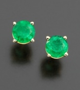 Burst onto the scene with eye-catching green. Stud earrings feature vibrant, round-cut emeralds (1 ct. t.w.) in a 14k gold post setting. Approximate diameter: 5 mm.