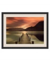 A wooden dock pierces the utopian scenery of Cumbria, England's Lake District. Jagged mountains separate the rose-colored sky from a still, glassy lake. Framed in satin black, this large landscape has a naturally calming impact on any environment.