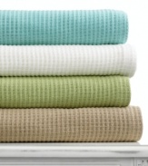 Add an extra layer of warmth to your bed or curl up on the couch with this cotton blanket from Martha Stewart Collection. Choose from either neutral or colorful hues.