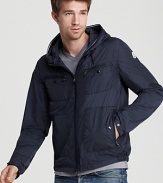 Lightweight but rigorously constructed, this handsome quilted jacket has you covered with an attached hood, gathered waist and snap wrists.