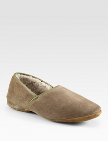 Suede slipper fully lined in genuine sheepskin for a warm, cozy fit.Suede upperSheepskin liningPadded insoleLeather soleMade in EnglandFur origin: Belgium