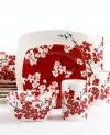 Bold red and white cherry blossoms bloom on a casual set for warm, contemporary decor. From 222 Fifth dinnerware, these dishes feature minimalist square shapes and contrasting vibrant florals. This fine china has a look that's forever in season.