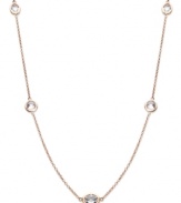 Layer yourself with inches of sparkle. This delicate necklace is crafted in 14k rose gold over sterling silver, with round-cut white topaz stations (9 ct. t.w.). Approximate length: 36 inches.