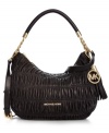 Poised, polished and practical, this lady-like silhouette from MICHAEL Michael Kors offers a touch of elegance to any ensemble. Luxurious leather is elegantly pleated and adorned with shimmery custom hardware and chain-link detail, while the interior is outfitted with plenty of pockets for the everyday essentials.