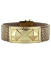 Stand out from the crowd. Pyramid studs bring a fashionable edge to this magnetic snap bracelet from Vince Camuto. Crafted from gold-tone mixed metal. Approximate length: 8 inches.